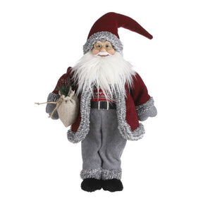 Julemand i mørkerød frakke og nissehuse samt grå bukser og luffer og strikket sweater, nissebriller og hvidt juleskæg med julesæk i hånden. Har et hjemmelavet flot look over sig. 