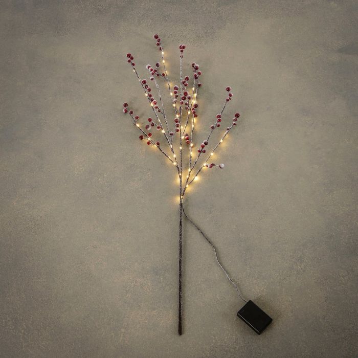 Gren med bær, frost og lys indendørs brug