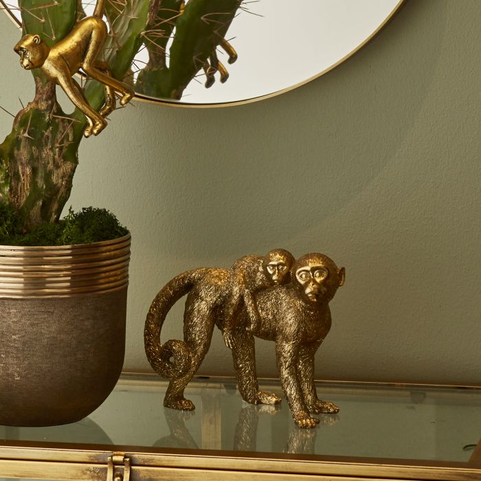 Guldfarvet abe med unge på ryg