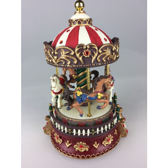 Nostalgisk musikkarrusel fra Musicboxworld med fire pyntede heste, rødt og hvidt tag, gyldne ornamenter og glitrende røde sten