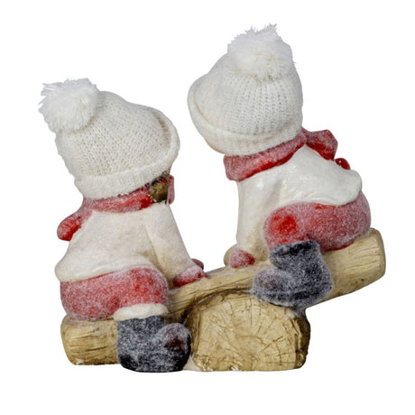 Vinterbørn på vippe set bagfra