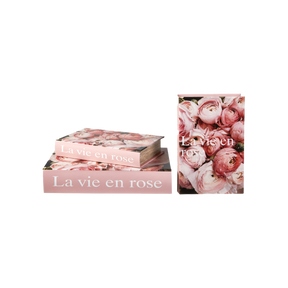 Speedstberg opbevaringsæsker udformet som bøger med blomster og teksten La vie en rose