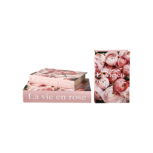 Speedstberg opbevaringsæsker udformet som bøger med blomster og teksten La vie en rose