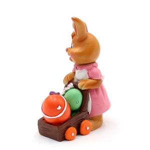 Påskehare med æg i trillebør