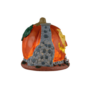 Pumpkin Skull House med lys i til Halloween dekoration fra Lemax set fra siden med muret skorsten