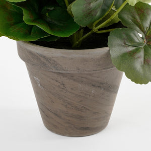 Grå lerpotte med kunstig pelargonie i 