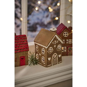 Honningkagehus med buet dør til fyrfadslys