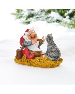 Julemanden spiser risengrød med katten