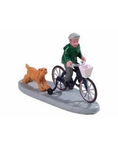 Dreng på cykel med hund