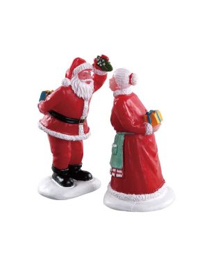 Father Christmas with his wife under the mistletoe